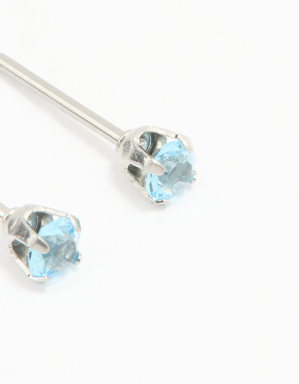 Featuring surgical stainless steel 3MM blue cubic zirconia piercing stud with sky blue stones and stud closure in silver close up view