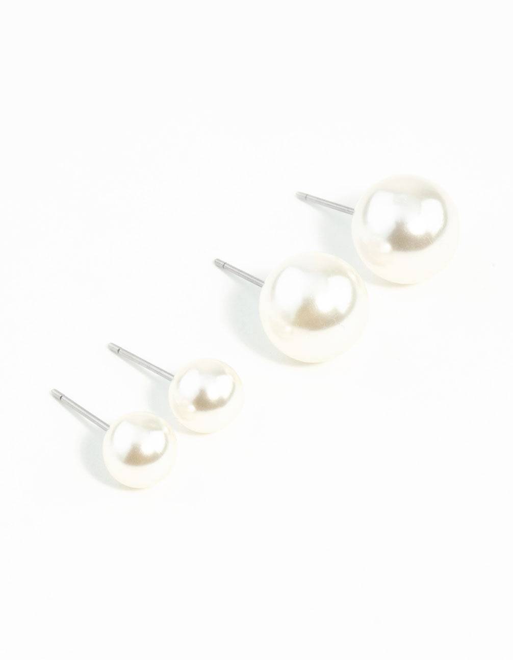 Crafted with pearl these stud earrings in a 2-pack in white tones front view