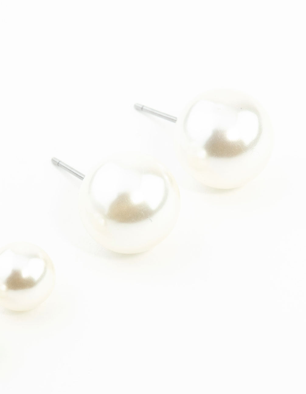 Featuring pearl stud earrings in a 2-pack in white tones post detail view