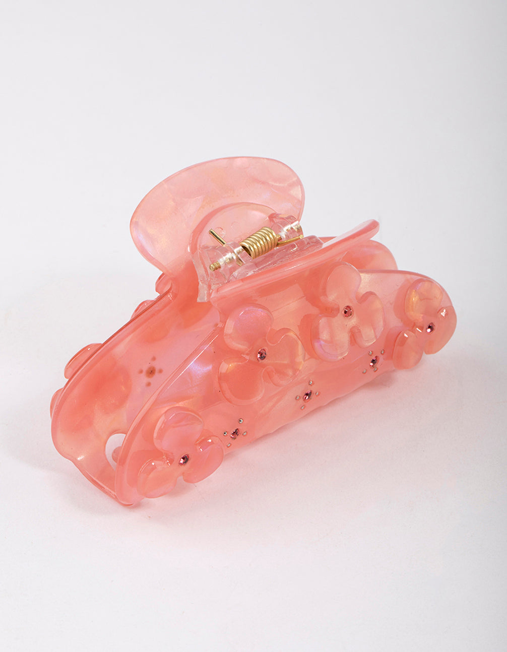 Presenting a blush acrylic flower diamante hair claw clip featuring floral design in pink and light coral side view