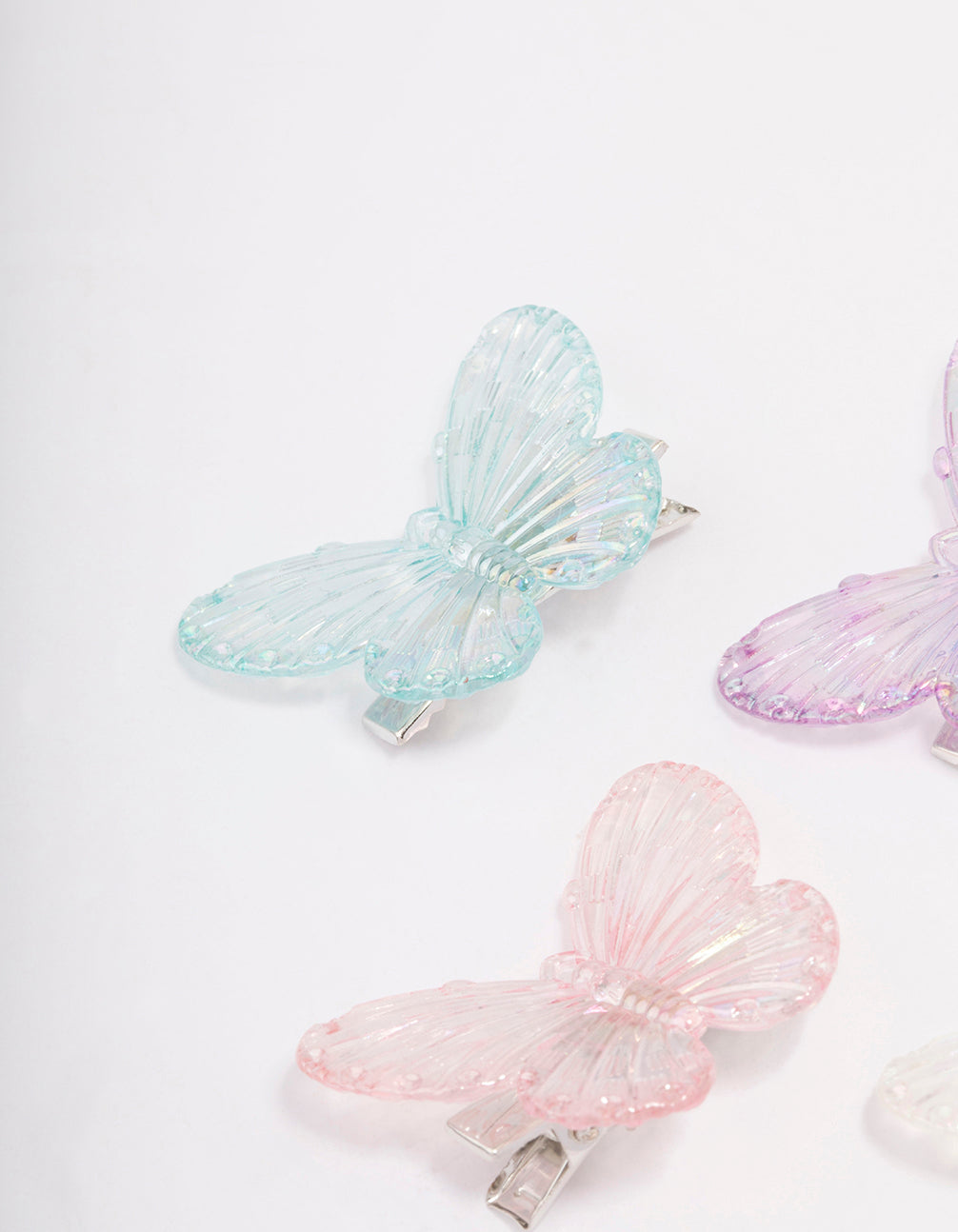 Showcasing pastel iridescent butterfly hair clip 4-pack featuring glitter in plum, light pink, pale turquoise, and silver side view