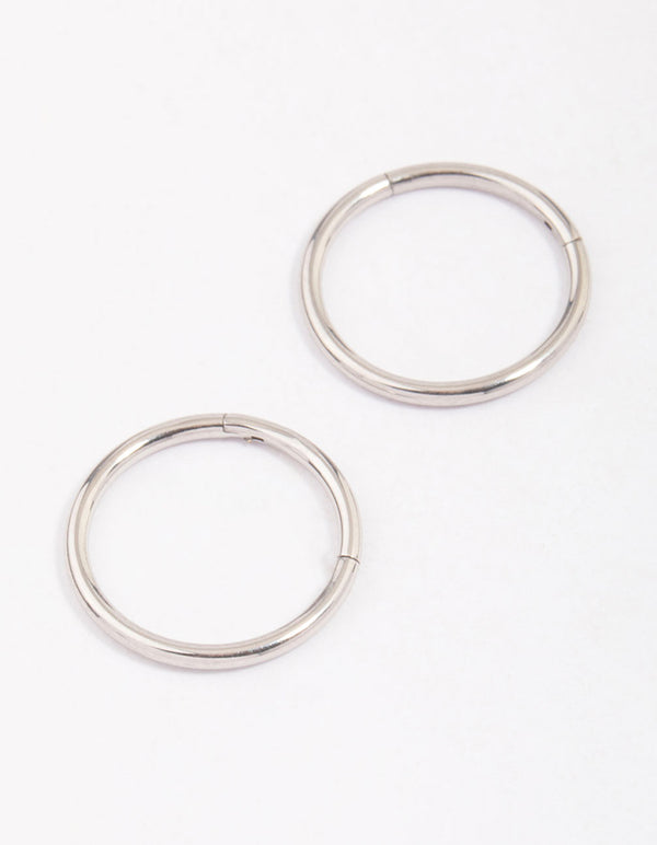 Discover dainty hoop closure earrings crafted from surgical steel in silver front view