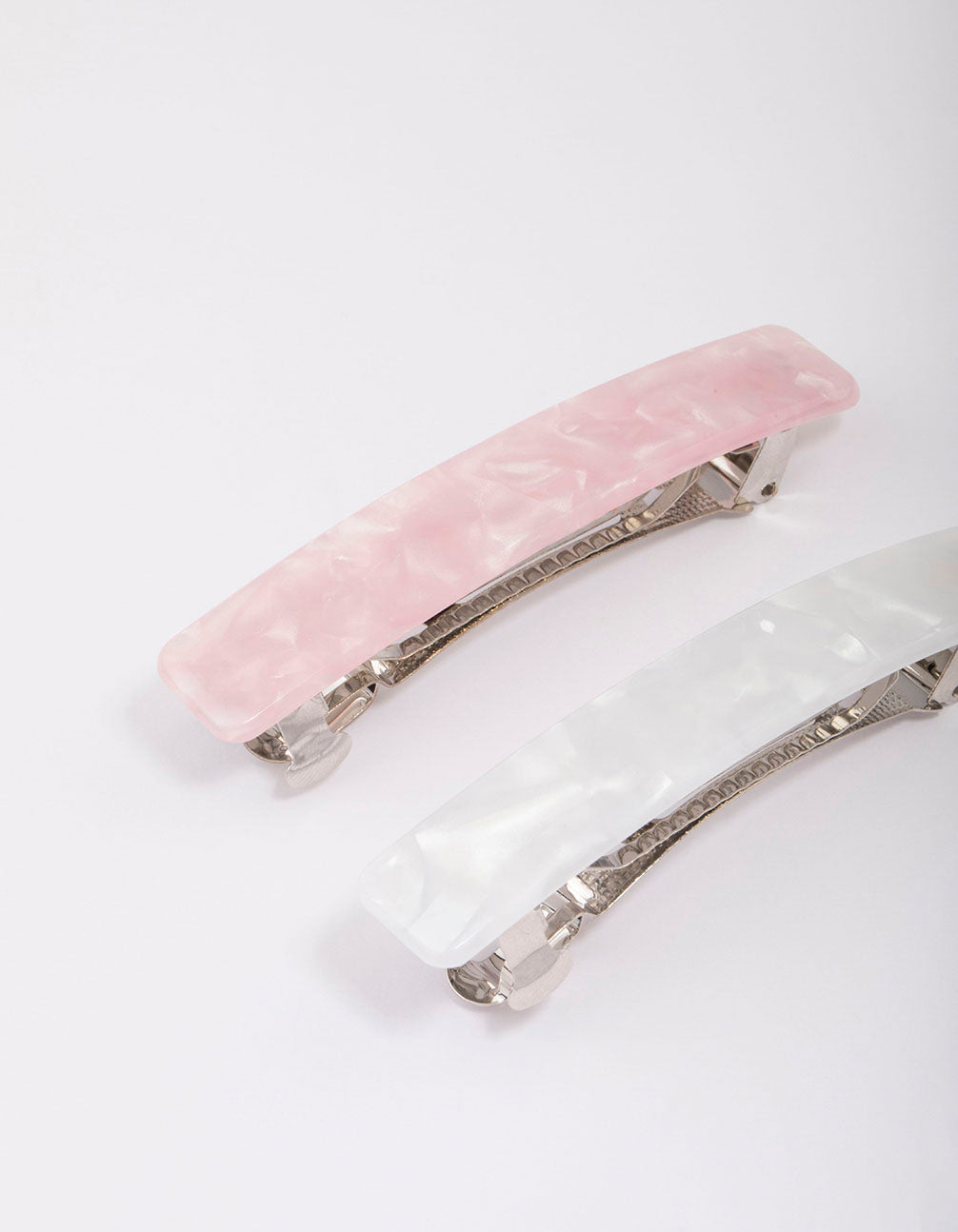 Crafted pink and white marble barrette hair clips in silver hardware detail view