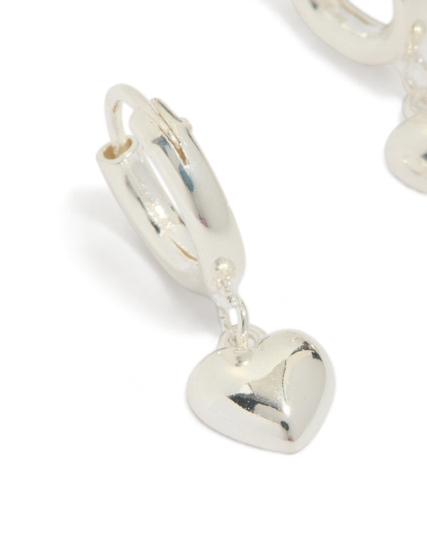 Presenting sterling silver chubby heart hoop earrings close up view
