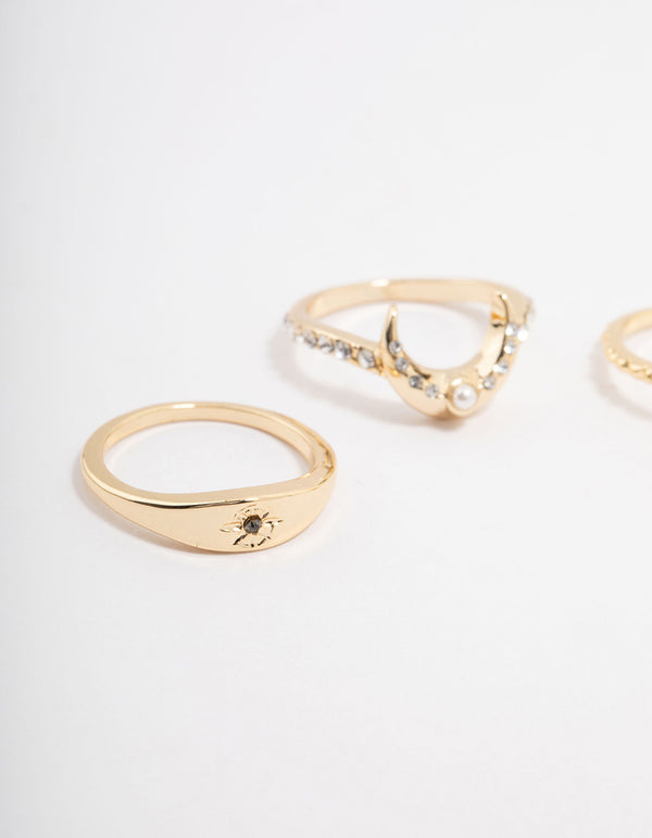These celestial dainty stacking rings in gold plated material showcase pear stone cut and pearl details close up view