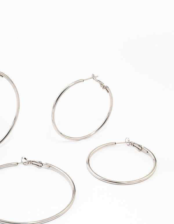 Highlighting waterproof stainless steel thin hoop earrings in a silver 3-pack post detail view