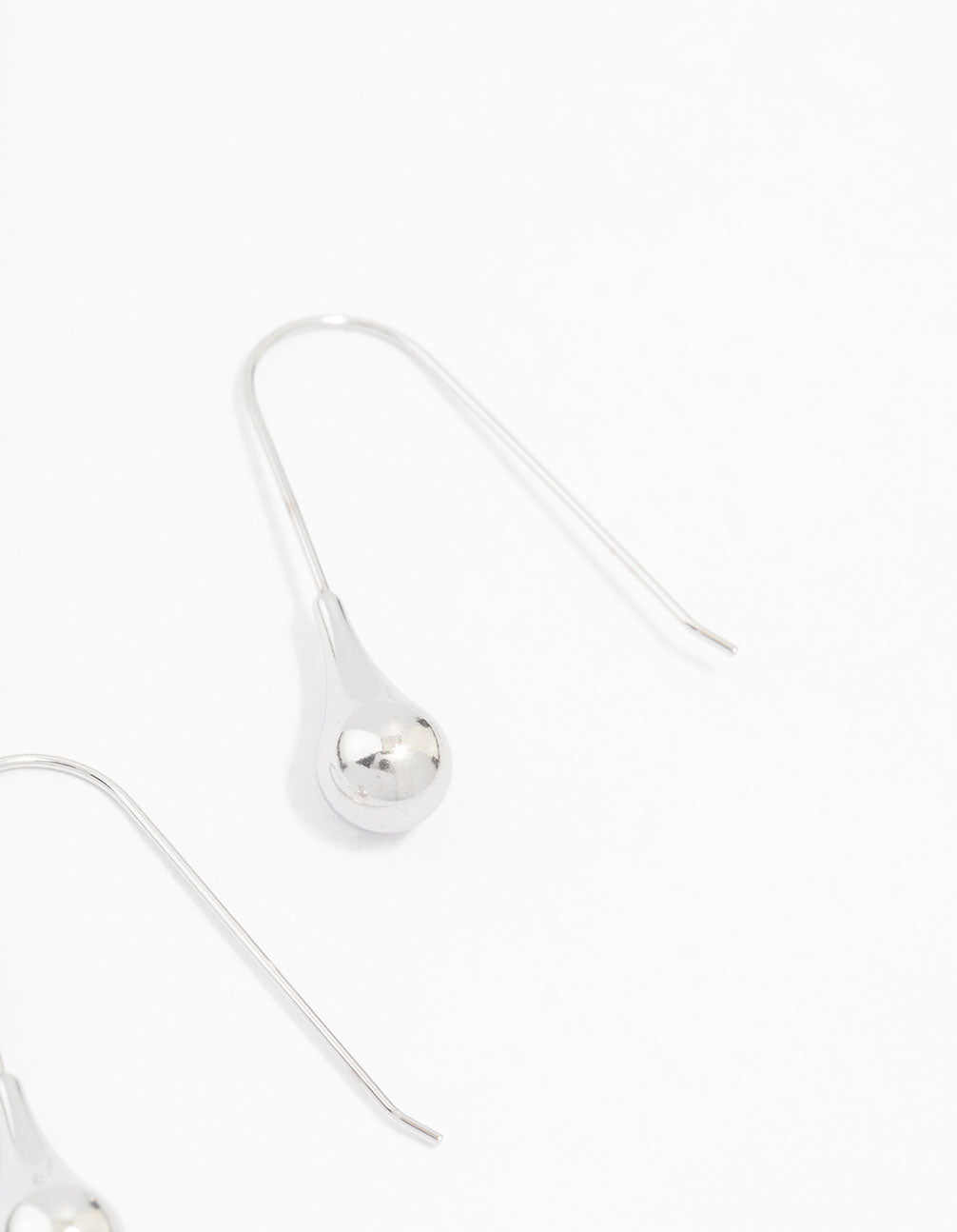 Elegant waterproof stainless steel thread through earrings with ball detail in silver post detail view