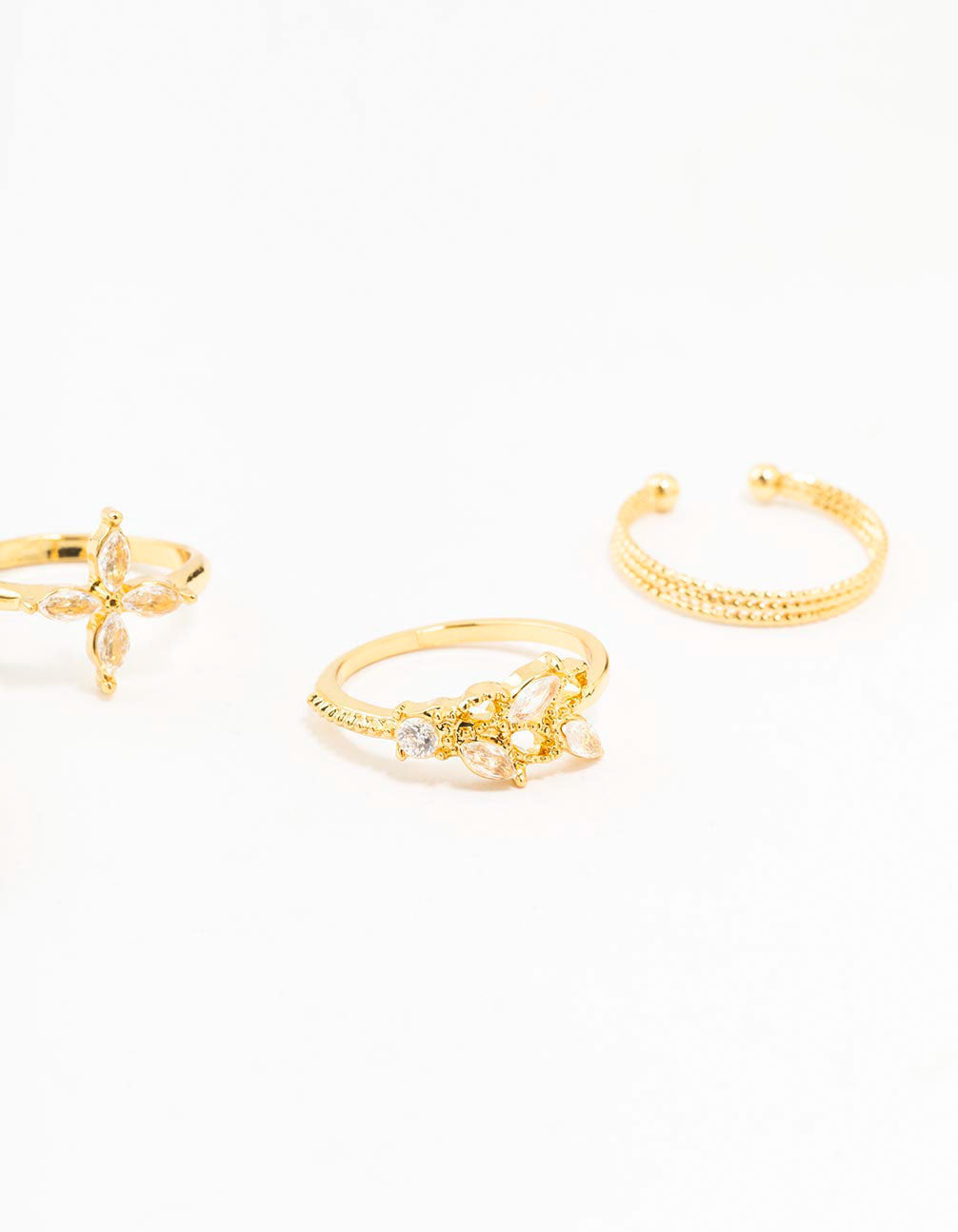 Elegant gold plated cubic zirconia leafy mixed rings 5-pack showcasing floral design in clear tones side detail view