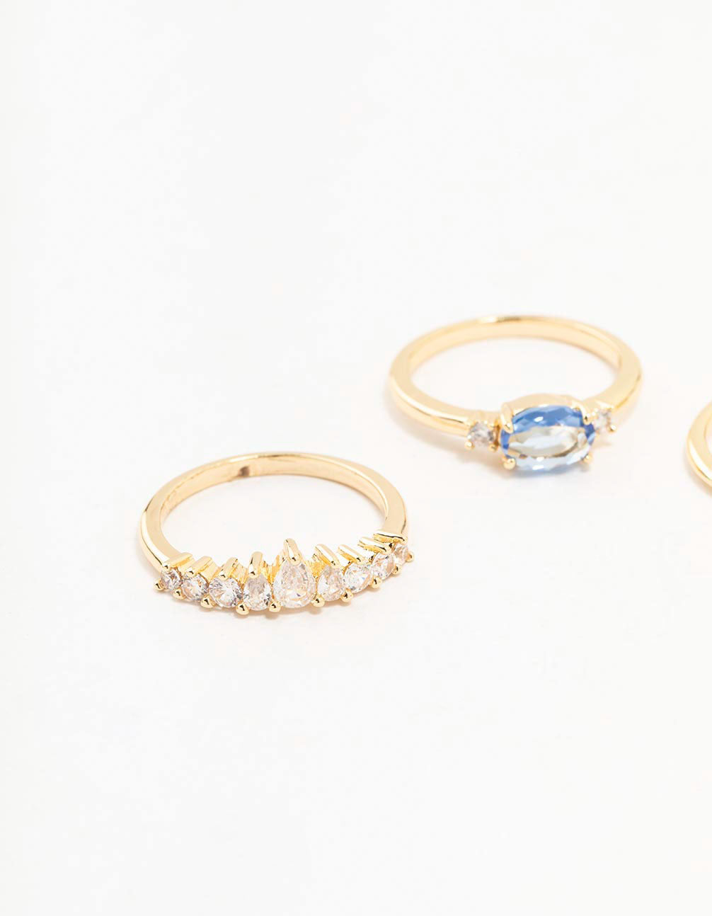 Stunning gold plated blue stone and fan cubic zirconia ring pack with crystal accents close up view