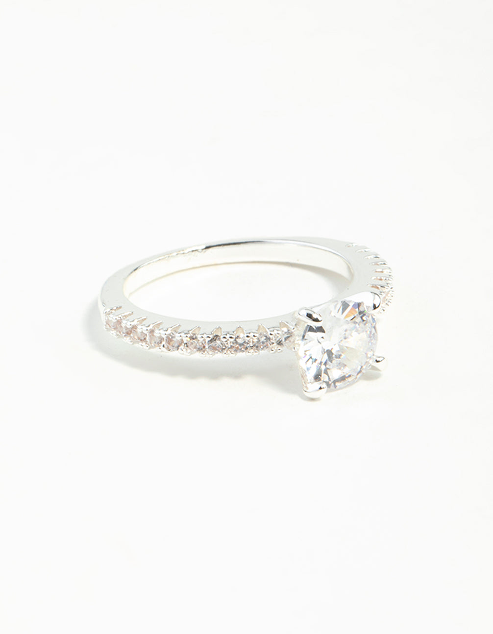 Showcasing a silver plated round cubic zirconia textured band ring with clear accents front view
