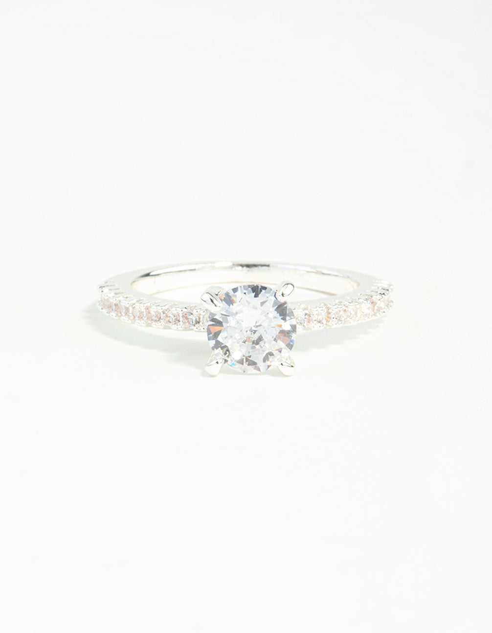 Elegant silver plated round cubic zirconia textured band ring with clear accents close up view