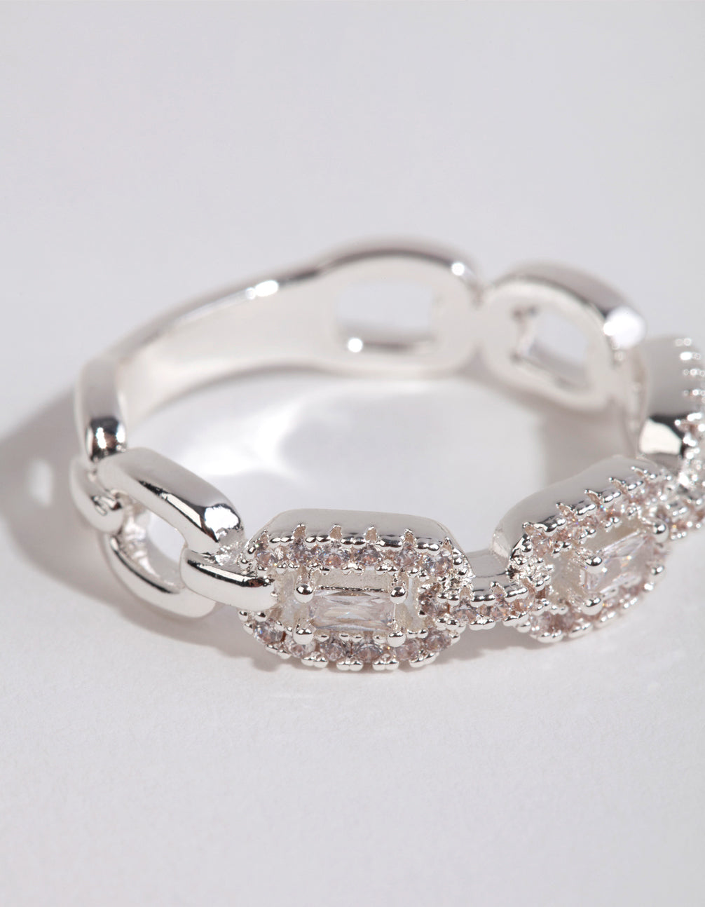 Showcasing the silver plated cubic zirconia chain ring with in white close up view