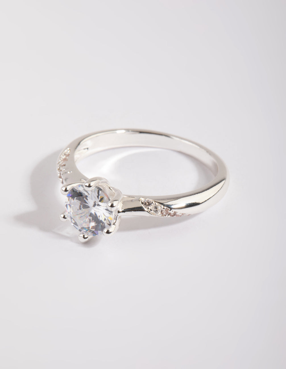 Elegant silver plated twisted ring with cubic zirconia in a dainty style front view