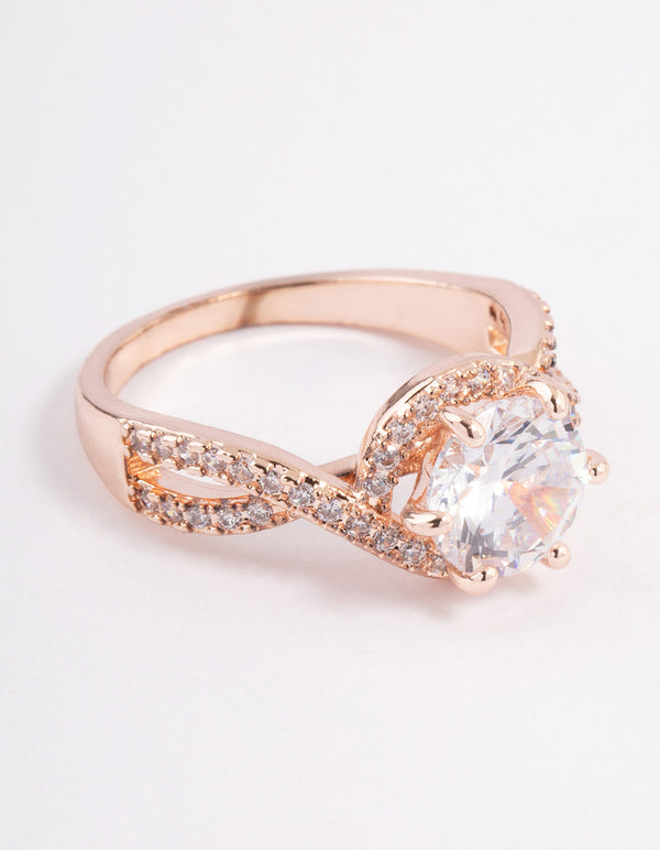 Beautifully crafted rose gold round infinity halo ring featuring cubic zirconia close up view