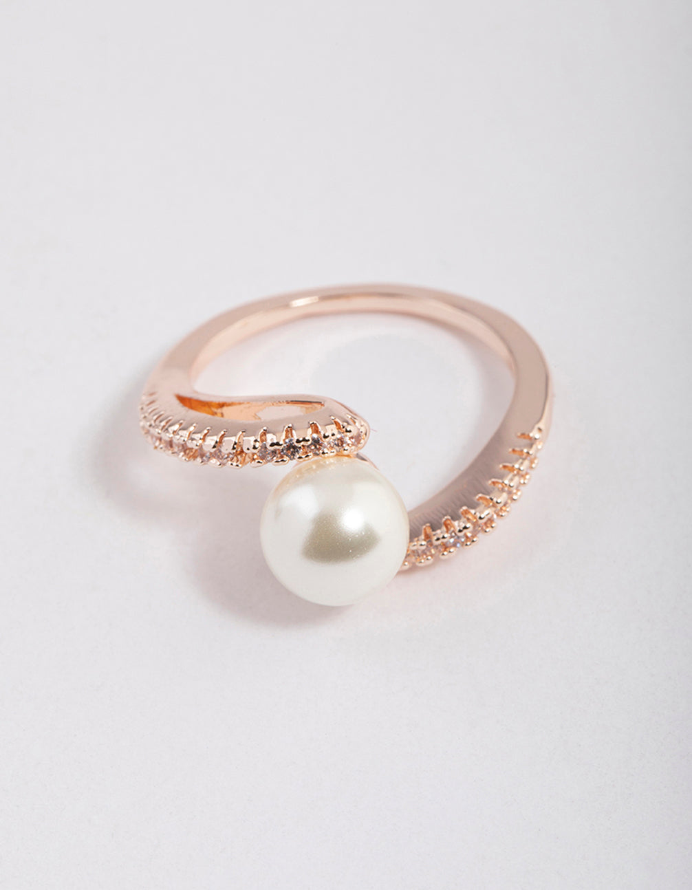 Showcasing a rose gold plated wrapped pearl ring with dainty design front view