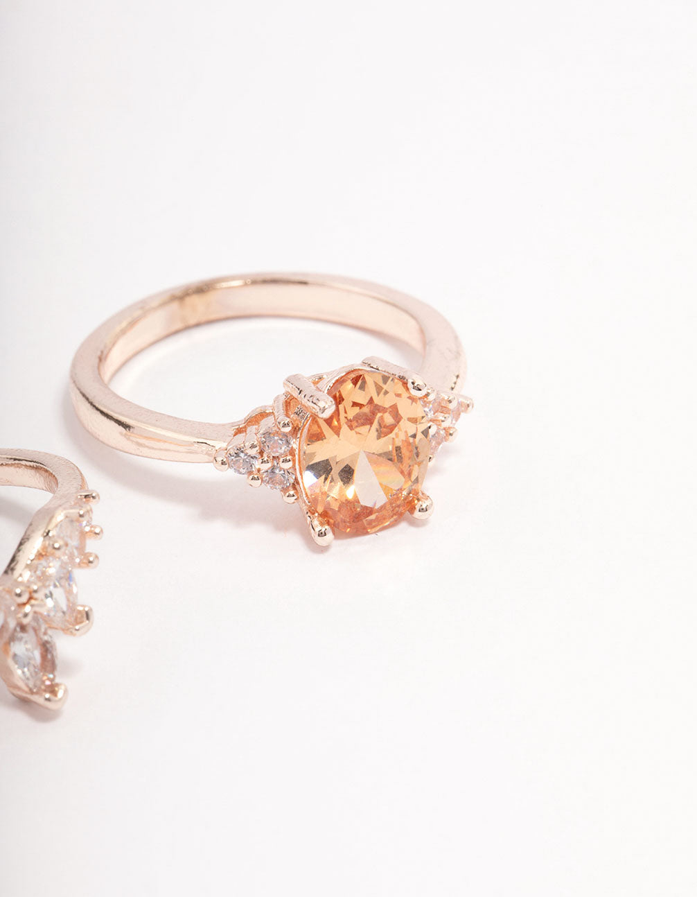 Featuring rose gold arched ring pack accents in dainty design side detail view