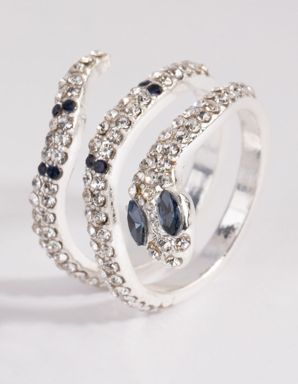 Elegant silver diamante blue-eyed snake ring with navy embellishments side detail view