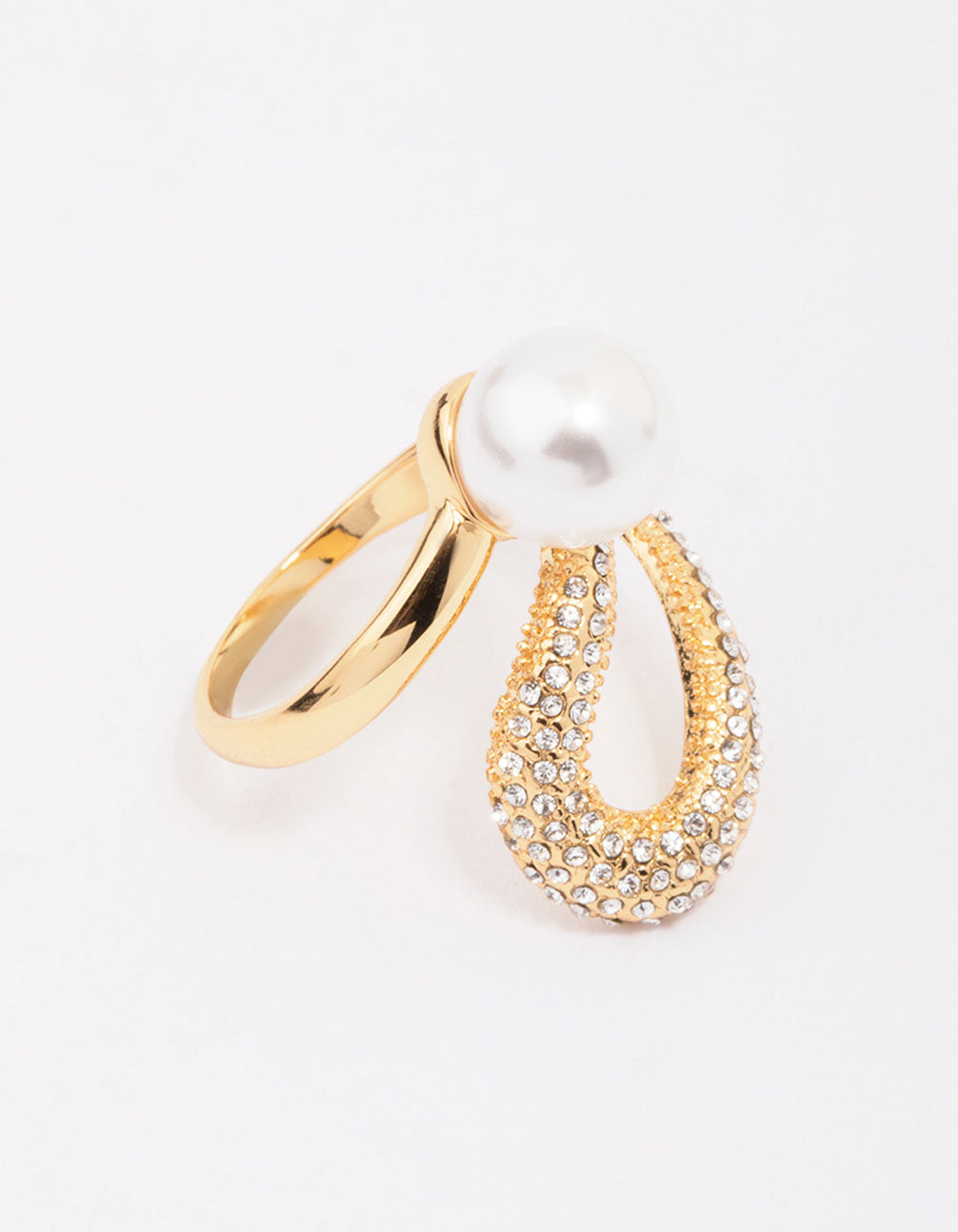Displaying a gold plated pave pearl cocktail ring with cubic zirconia close up view