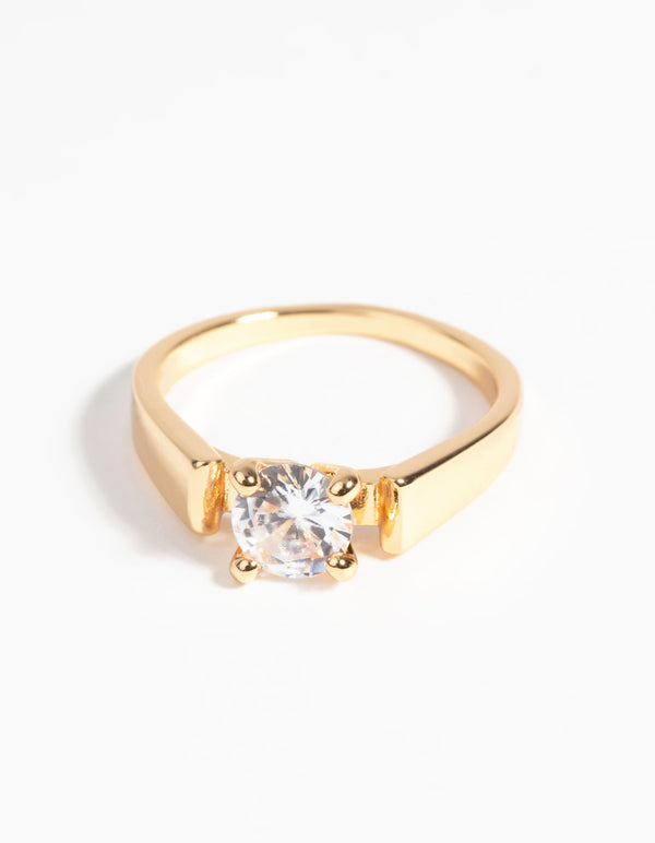 Discover a statement gold plated ring with cubic zirconia crystal in clear close up view
