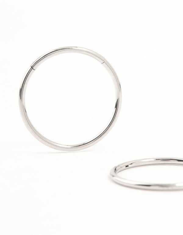 Featuring 14 mm surgical steel sleeper earrings in silver close up view