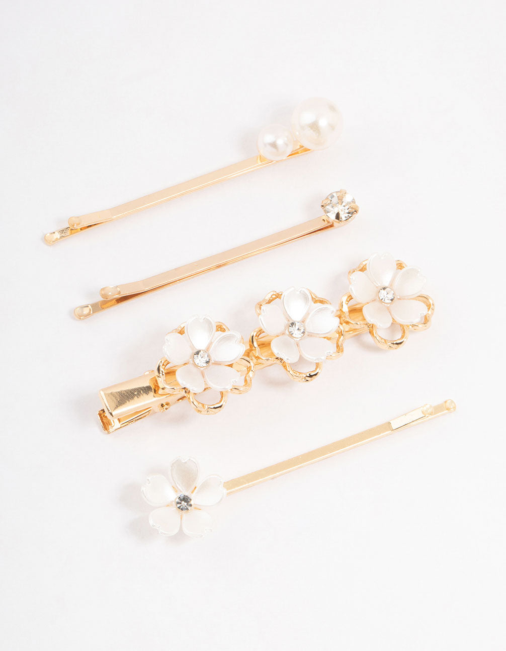 Explore these mixed gold pearl and flower hair clips with ivory in front view