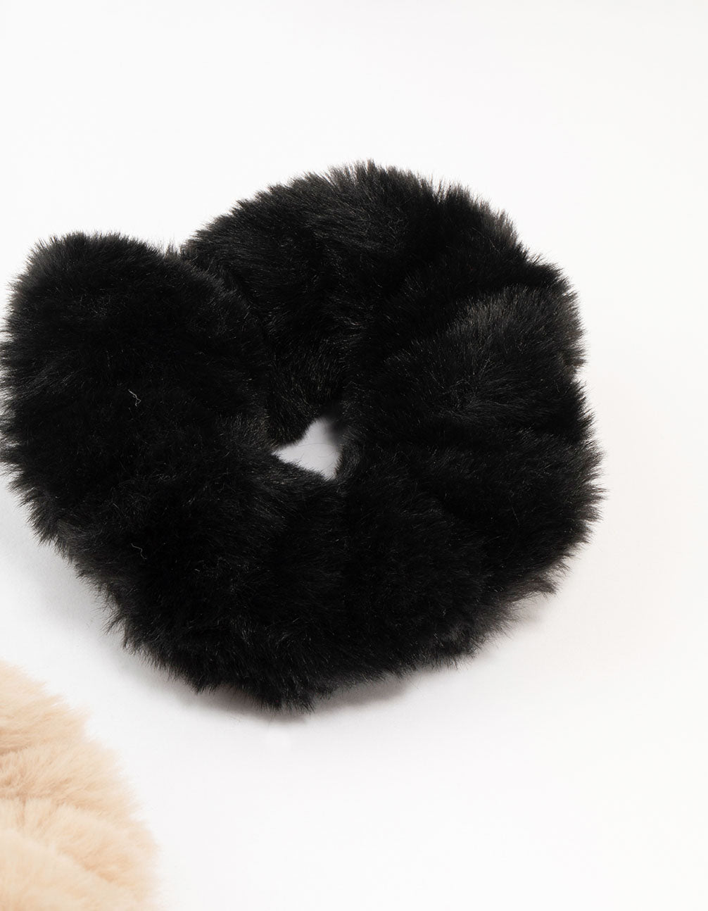 Featuring solid faux fur in a 2-pack with black and tan detail view