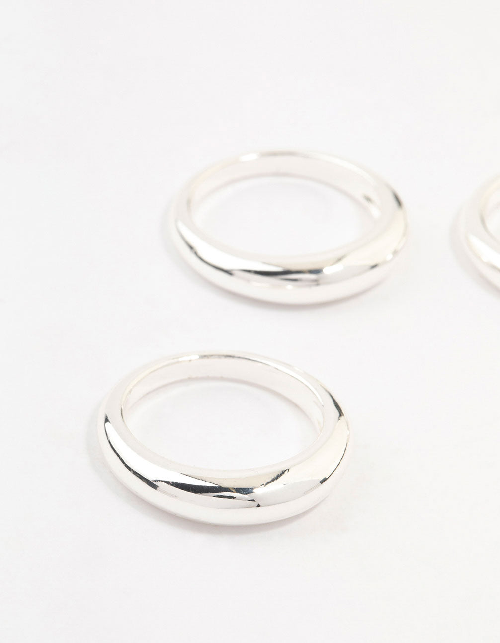 Crafted from silver plated material, this medium dome rings 3-pack shown in close up view