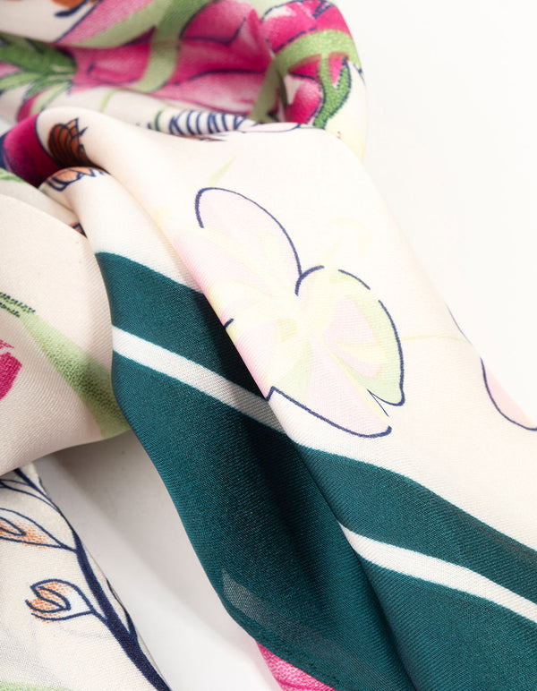 Featuring a multicoloured orchid scarf with leaf and floral print in teal, deep pink, olive drab, and orange design side view
