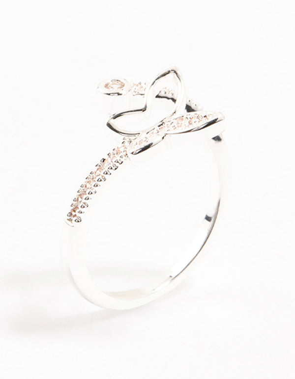 Elegant butterfly wrapped ring crafted from silver plated metal with cubic zirconia accents side detail view
