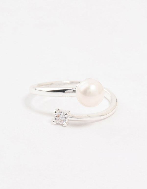 Elegantly designed dainty silver plated ring wrapped with cubic zirconia and pearl accents front view