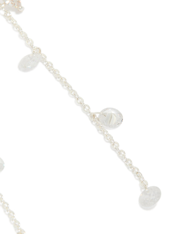 Delicately designed silver plated cubic zirconia flower station drop earrings with floral charm accents post detail view