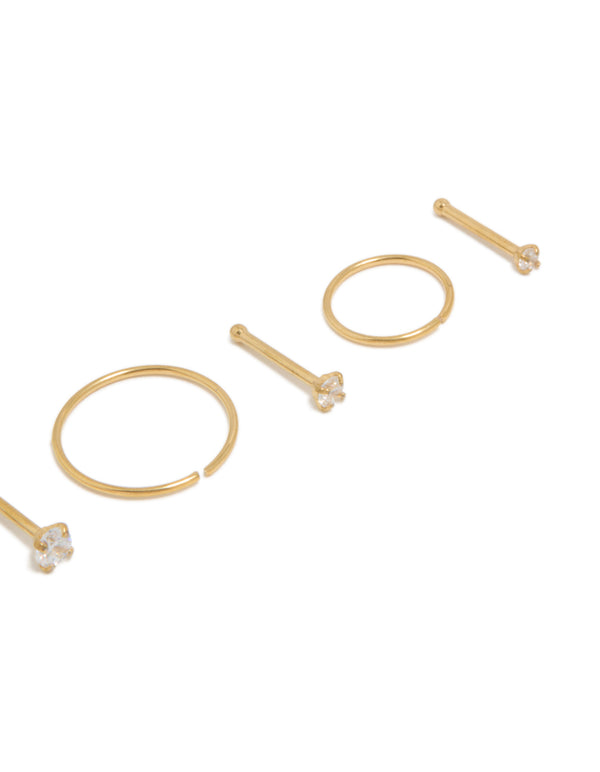 Crafted from gold plated titanium with cubic zirconia studs and hoop rings in close-up detail view