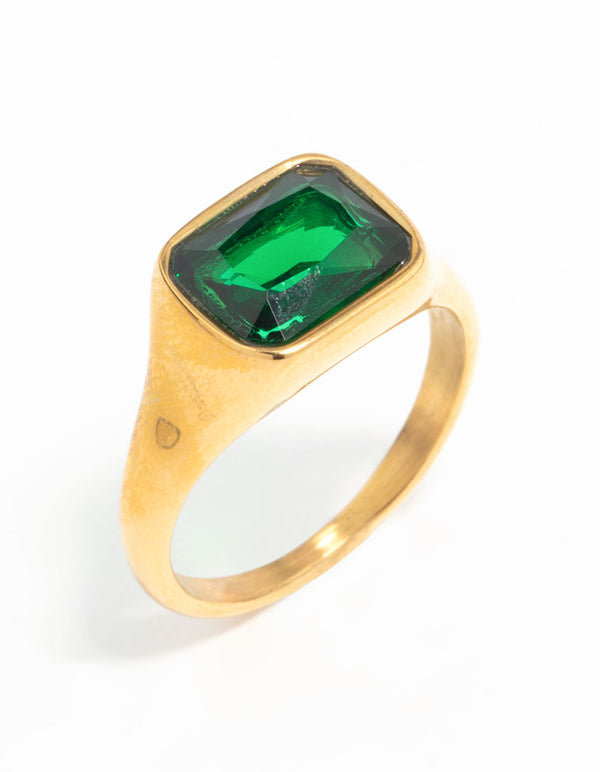 Presenting a waterproof signet ring in gold plated stainless steel with an opulent green cubic zirconia crystal side detail view