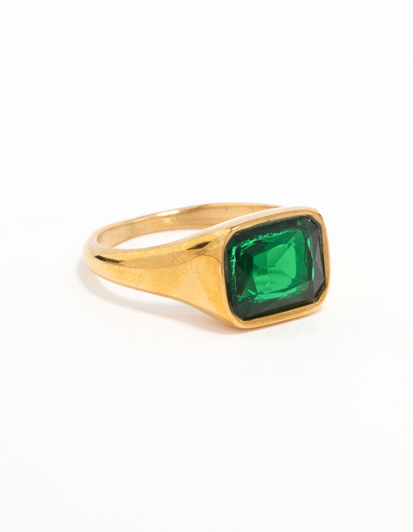 Showcasing a waterproof signet ring crafted from gold plated stainless steel featuring an opulent green cubic zirconia crystal front view