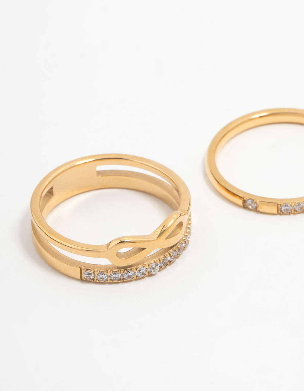 Featuring waterproof gold plated stainless steel infinity rings in a 3-pack close up view