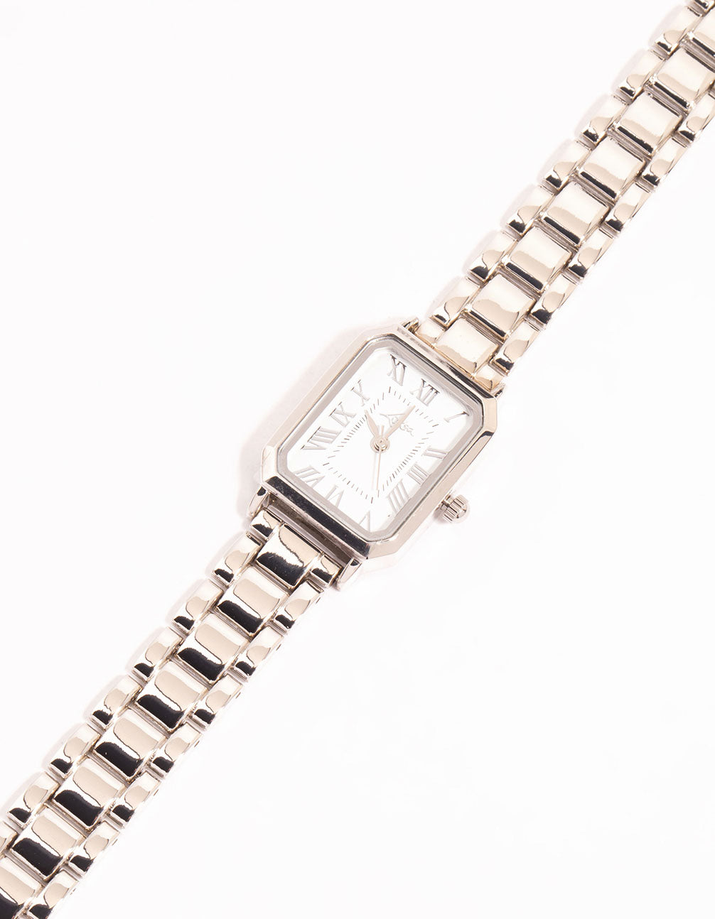 Showcasing a women's analog watch with white dial featuring roman numerals, rectangle shape designed for formal occasions, link band in silver watch face detail view