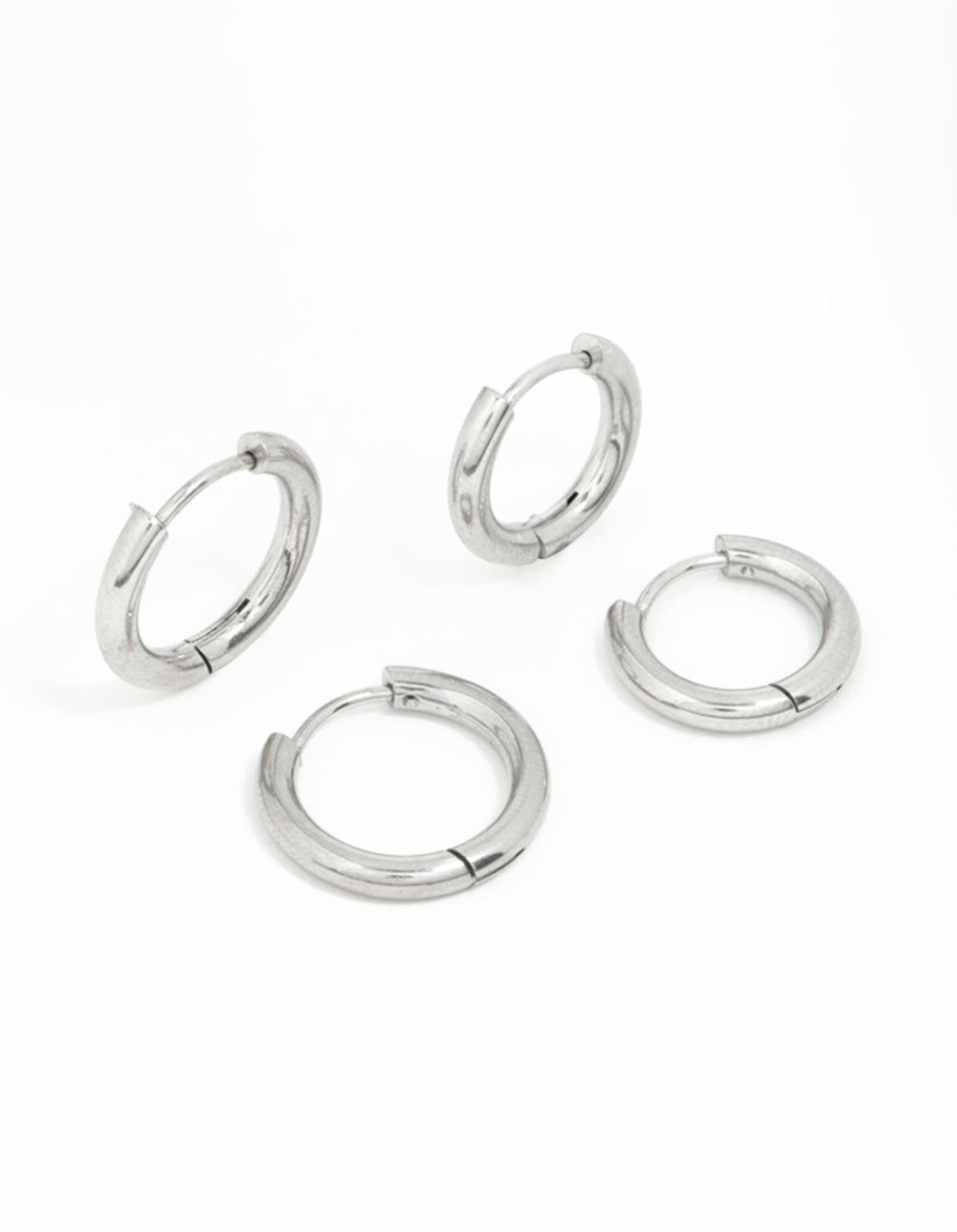 Presenting surgical steel thick hoop earrings in a 2-pack with silver hoop closure front view