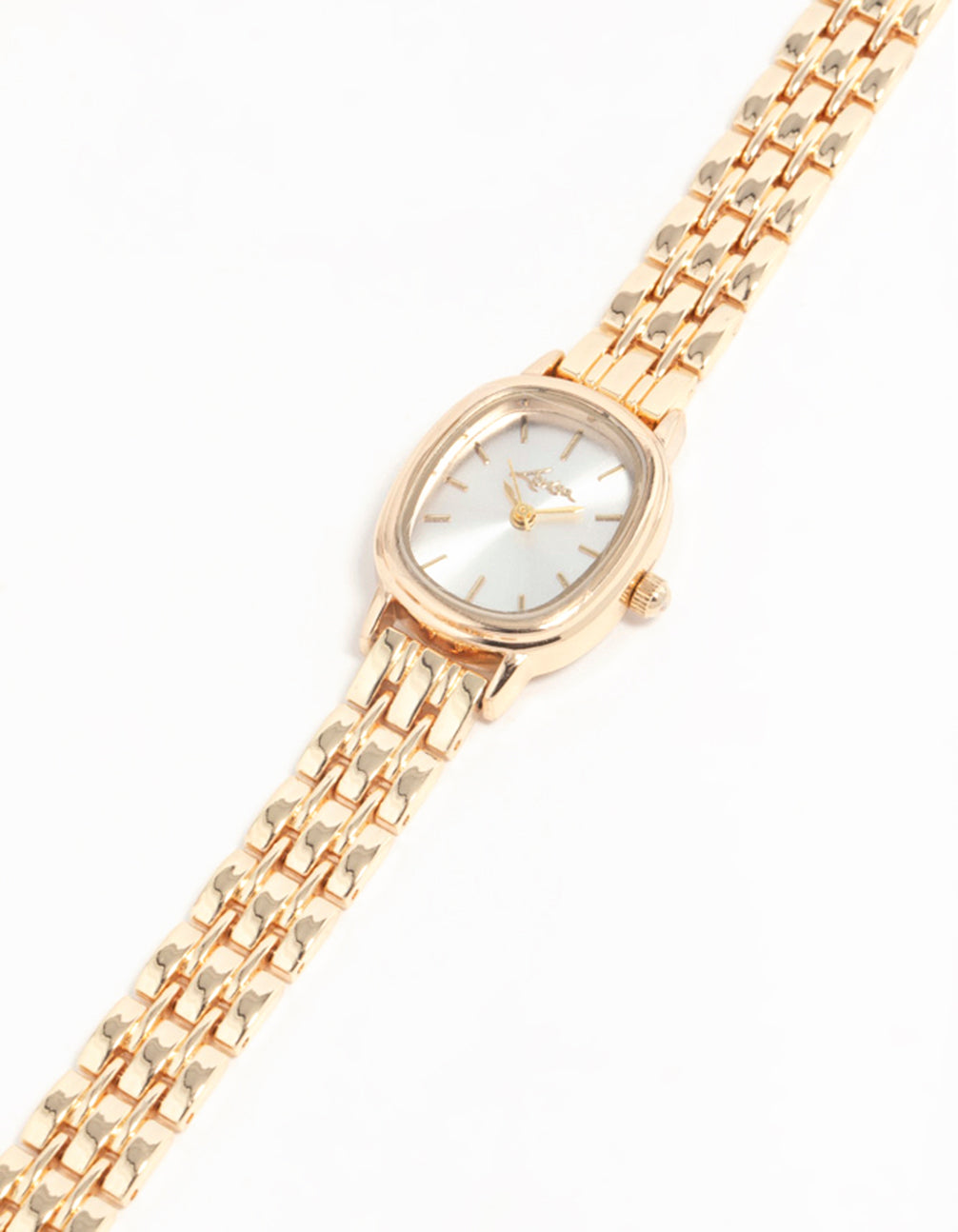 Elegant small oval watch with white dial, analog type, women's formal design, link-band strap in gold watch face detail view
