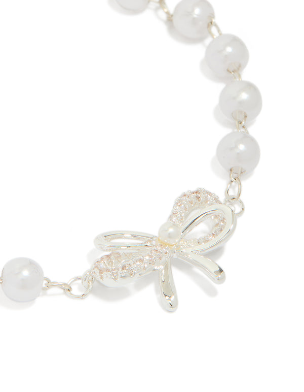 Highlighting the bow with pearl featuring in silver plated finish close up view