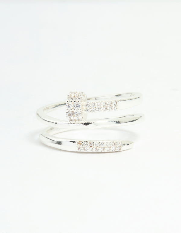 Highlighting a statement nail wrap ring crafted from silver plated metal, featuring cubic zirconia stones close up view