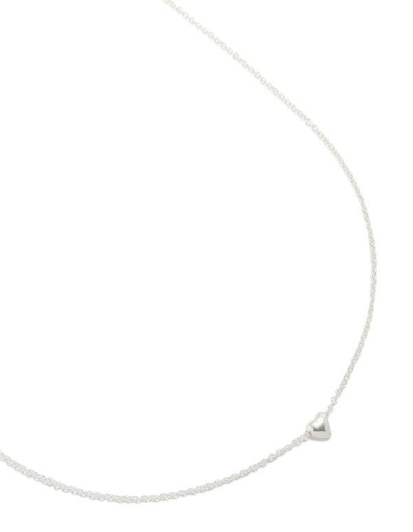 Crafted from sterling silver, this heart pendant necklace is shown in a close up view