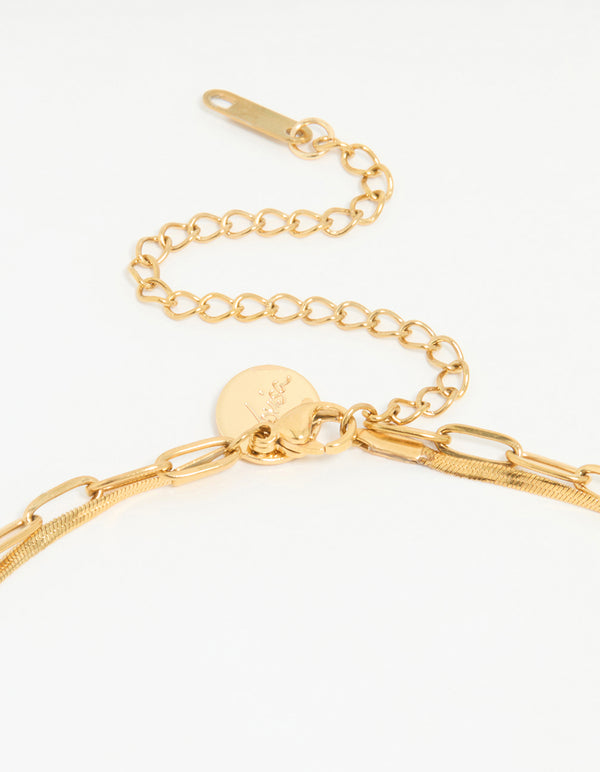 Highlighting a waterproof double link layered chunky style necklace with gold plated stainless steel construction clasp detail view