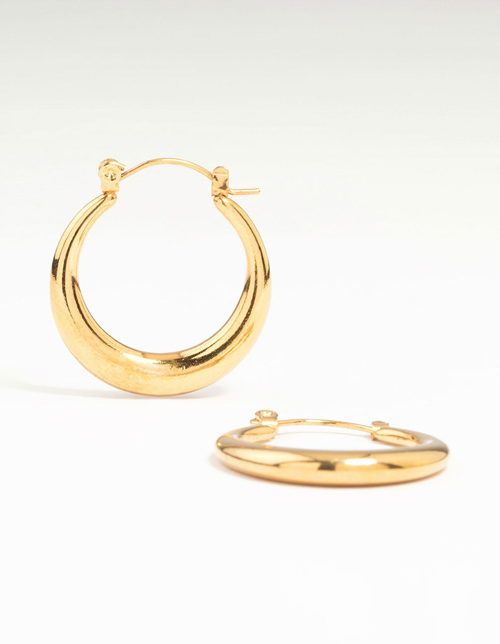 Showcasing waterproof crescent hoop earrings crafted from gold plated stainless steel in 18 MM front view