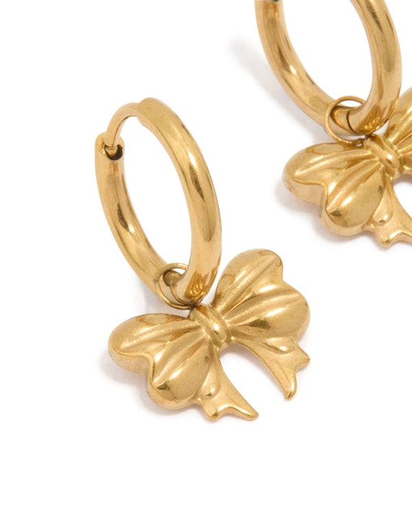 Highlighting bow hoop earrings in waterproof gold plated stainless steel close up view