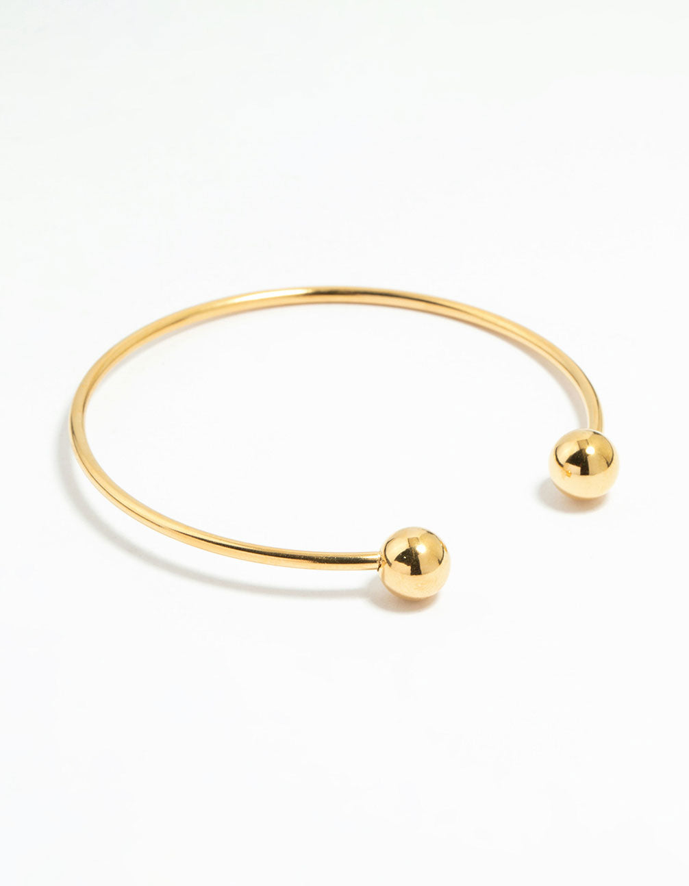 Showcasing a waterproof gold plated stainless steel ball wrist cuff bangle front view