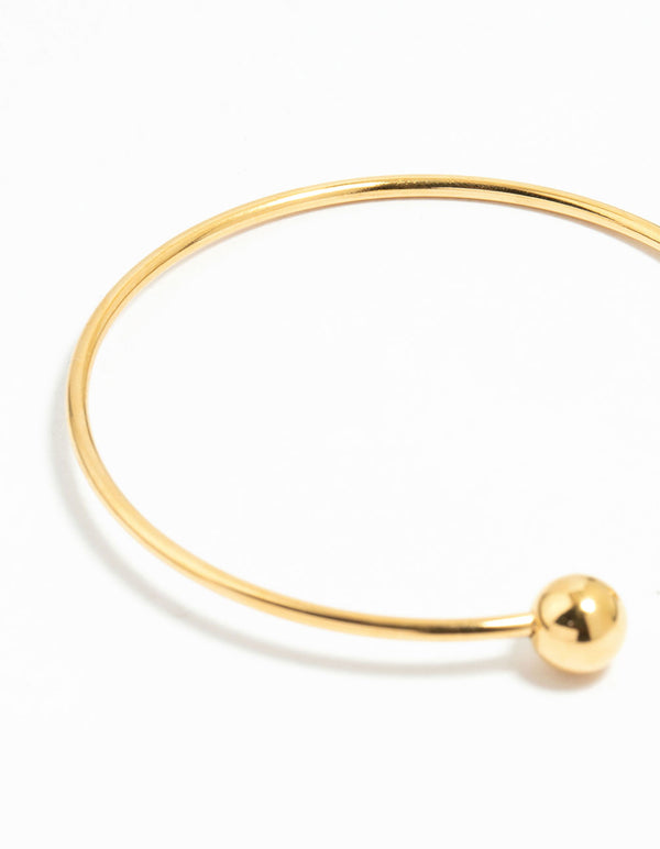 Crafted from waterproof gold plated stainless steel with balls, this cuff bangle is shown in a detail view