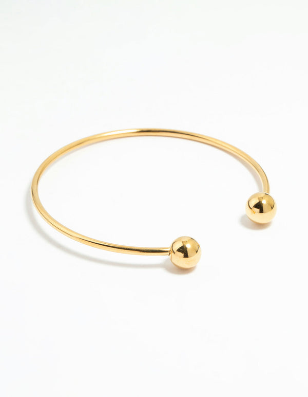 Showcasing a waterproof gold plated stainless steel ball wrist cuff bangle front view