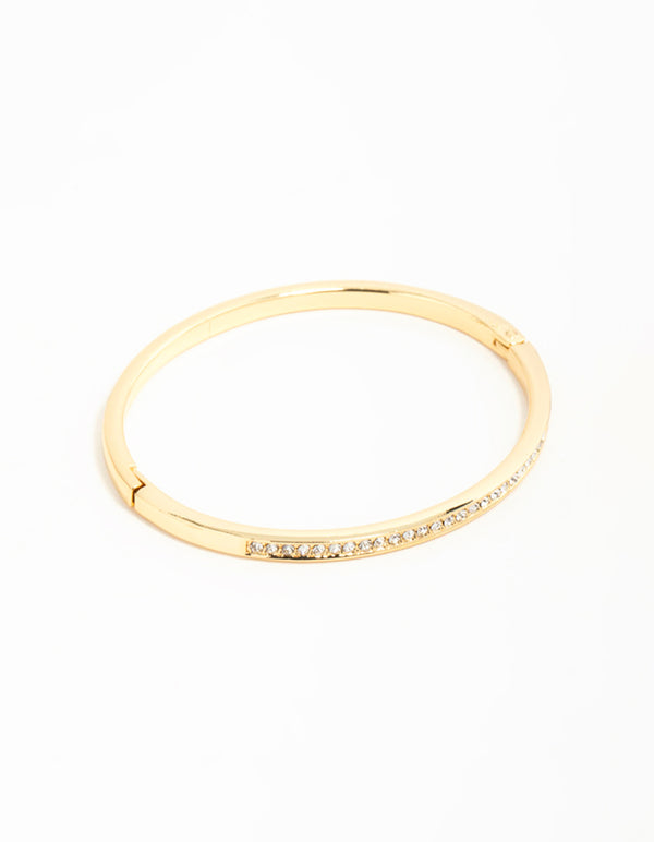 Showcasing a gold diamante hinged bangle front view