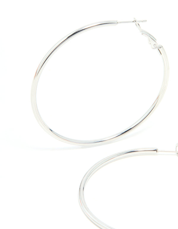 Presenting statement hoop earrings, 50 mm in surgical steel with silver finish close up view