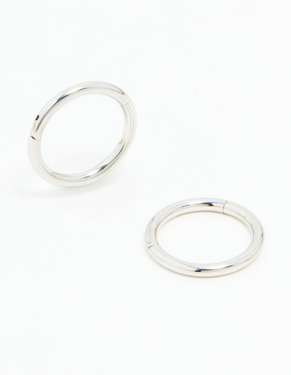 Explore these surgical steel sleeper earrings in 7mm, featuring dainty design with silver finish front view